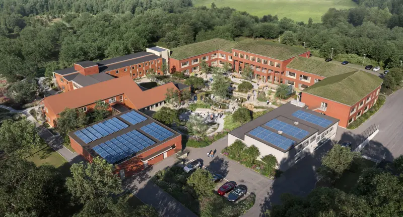 En visionsbild av hur det nya boendet kommer se ut, ovanifrån. Flera olika huskroppar syns.